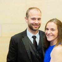 Couple posing in the Laker Lounge after the Enrichment Dinner